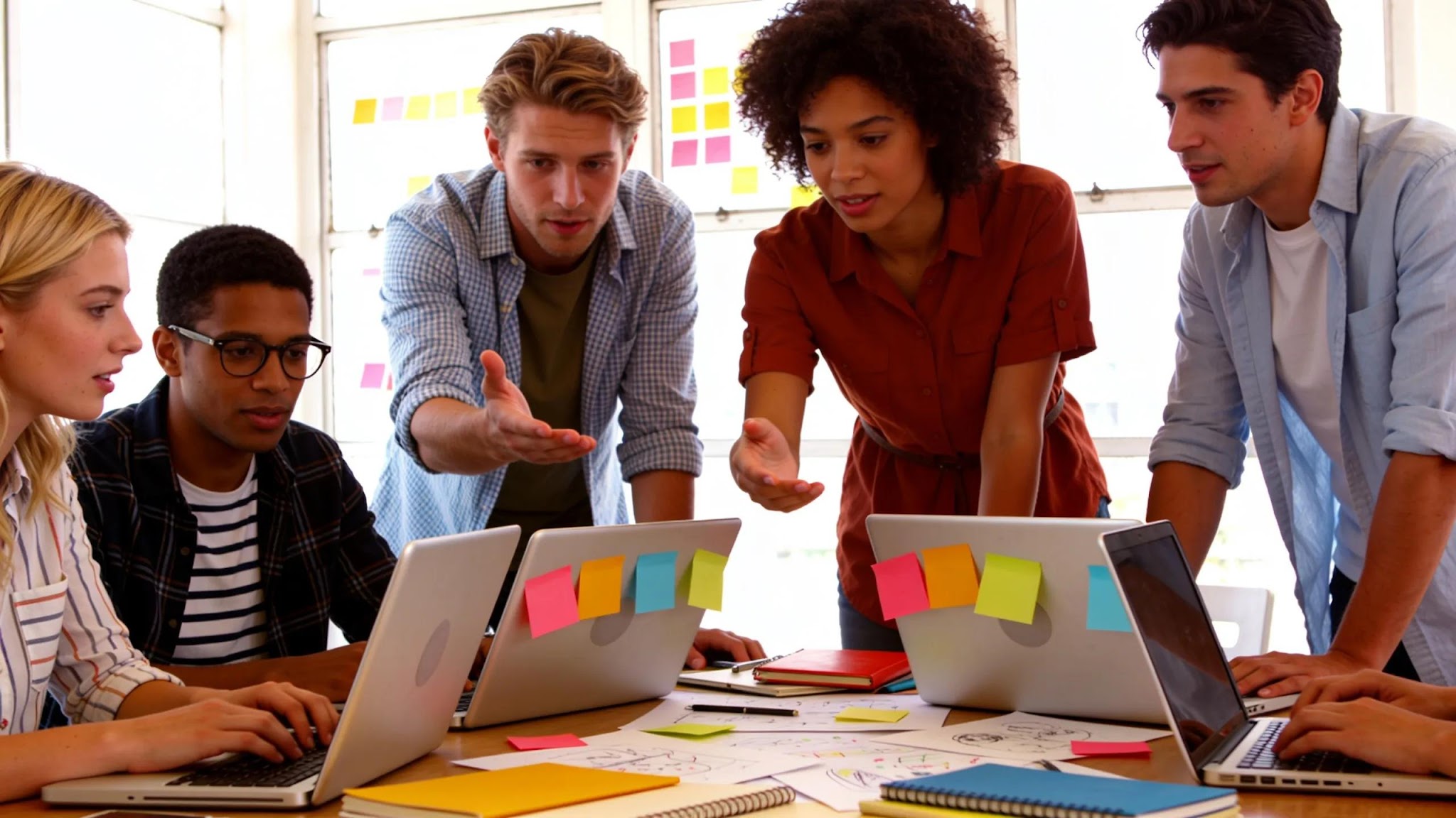 Group of creators collaborating on audience engagement strategies in a vibrant office setting